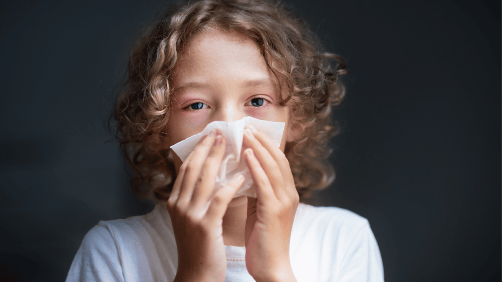 A boy sneezing nose due to Human Papillomavirus
