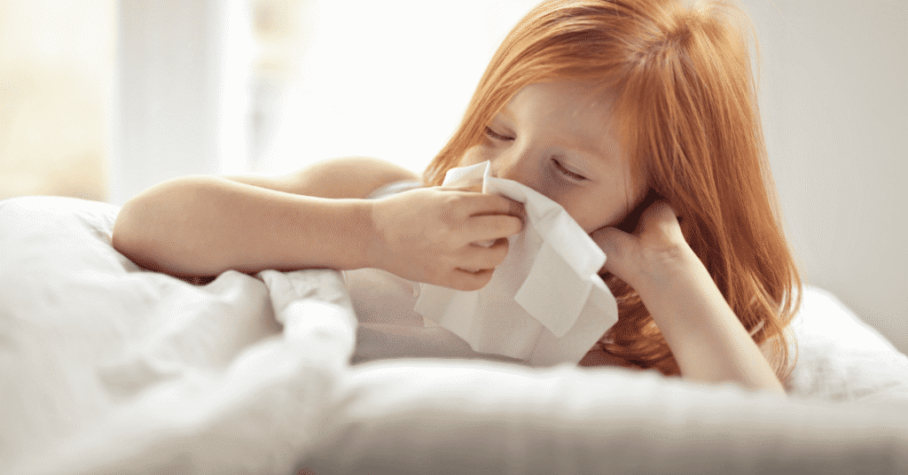 girl running nose due to flu